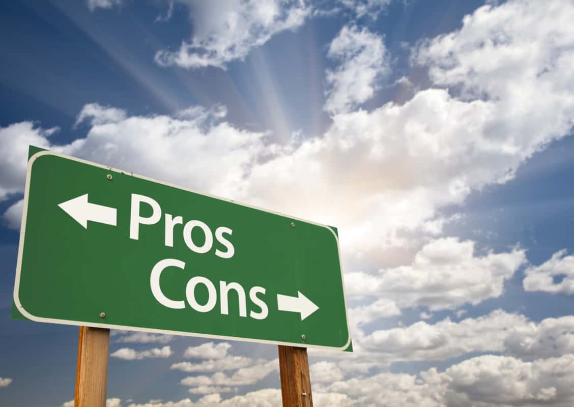 sign post stating direction of pros and cons
